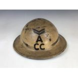 A Second World War Civil Defence steel helmet bearing rank and A / CC insignia