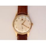 A 1950s gentleman's 9ct gold cased Zenith wrist watch, having a silvered face, Arabic numerals and