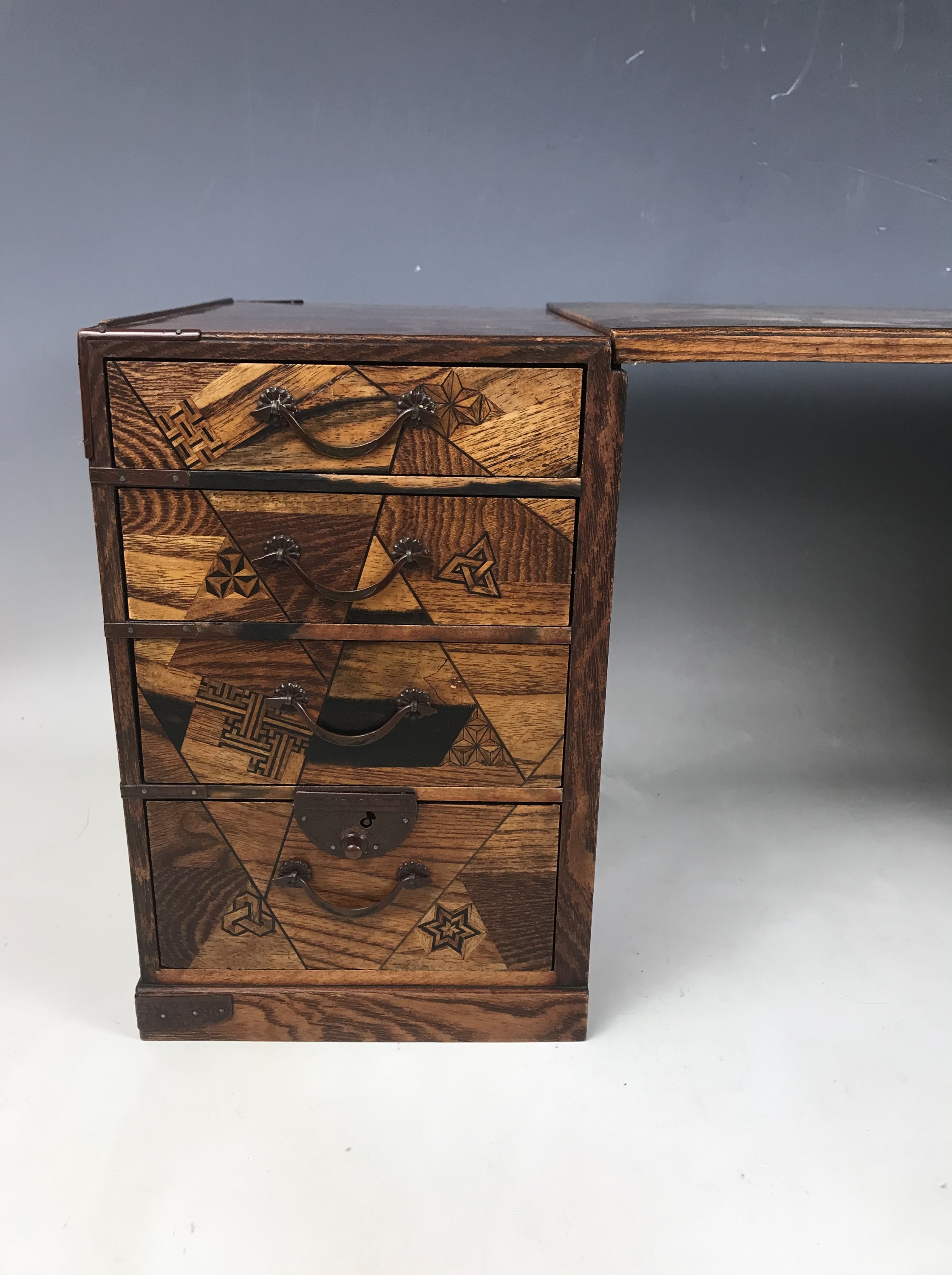 A late Meiji / Taisho Japanese kodansu cabinet / miniature kneehole desk, parquetry veneered - Image 4 of 6