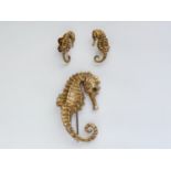 A vintage gilt white-metal seahorse garniture, comprising brooch and a pair of clip-on earrings,