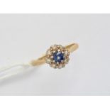 A vintage sapphire and diamond dress ring, pellet-set in a flower head cluster arrangement on an