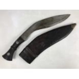 A Second World War military issue kukri, both scabbard and blade dated 1945