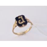 A yellow-metal and onyx initial ring, bearing the initial 'J', 1.9g