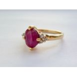 An 18ct gold, verneuil ruby and diamond ring, having a central oval-cut ruby of approximately 1.