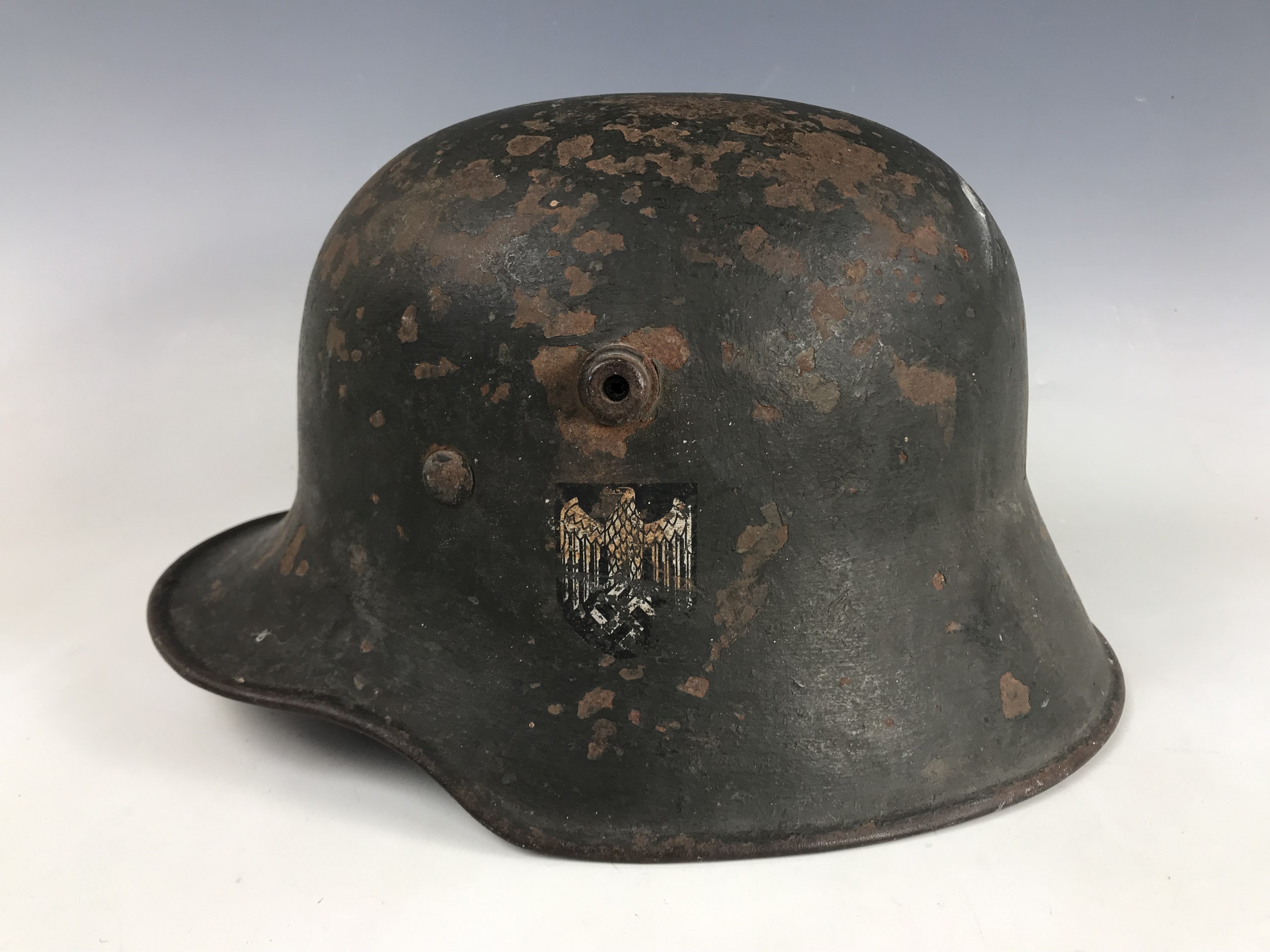 An Imperial German German steel helmet bearing German Third Reich Army decal and M 35 liner