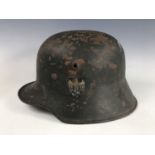 An Imperial German German steel helmet bearing German Third Reich Army decal and M 35 liner