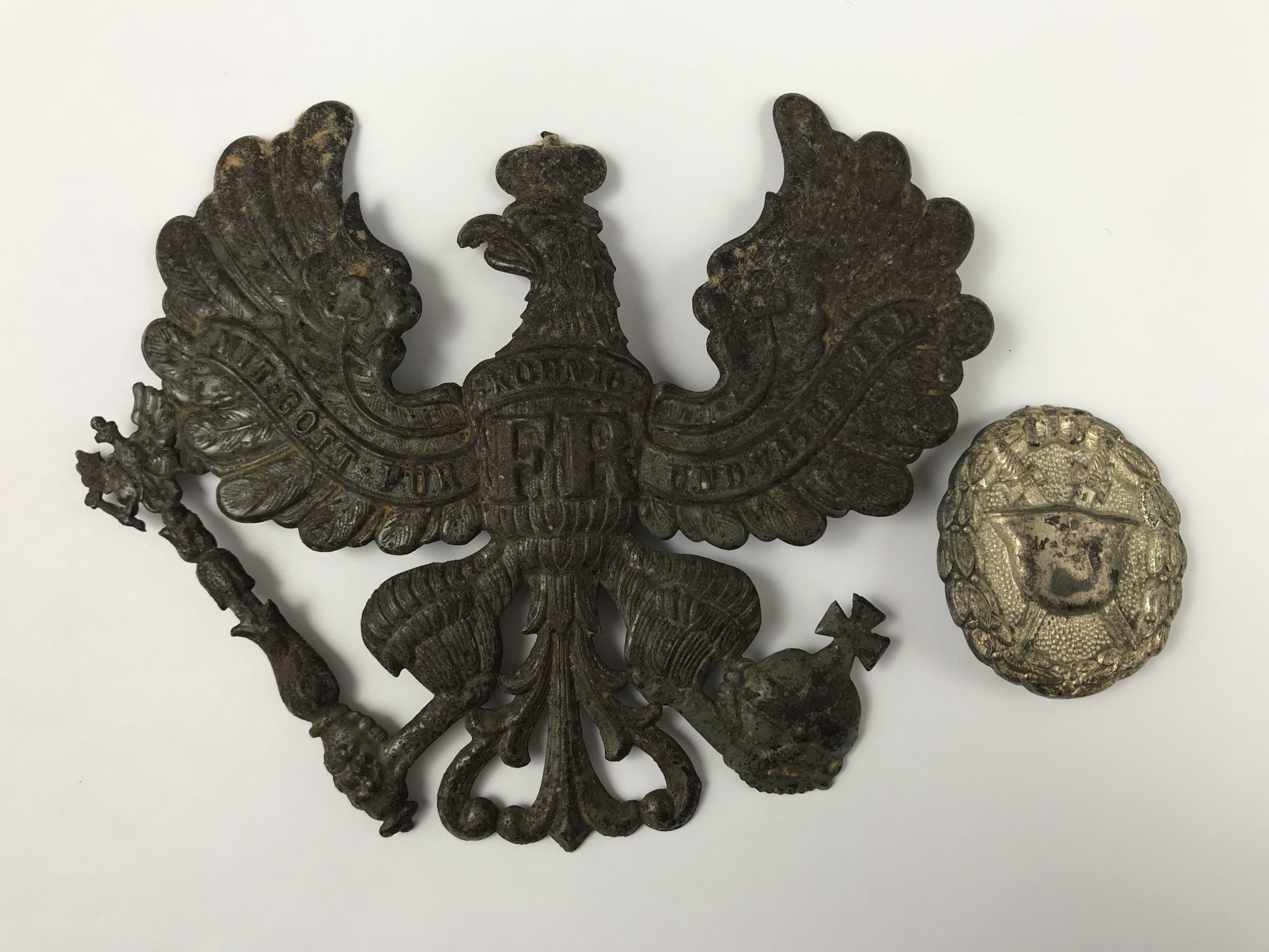 An Imperial German Prussian ersatz pickelhaube wappen and a wound badge