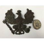 An Imperial German Prussian ersatz pickelhaube wappen and a wound badge