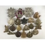 A quantity of Canadian cap badges