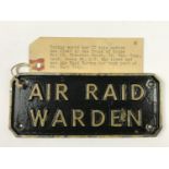 A Second World War cast alloy Air Raid Warden sign