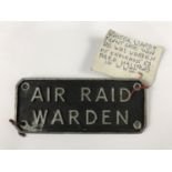 An "Air Raid Warden" cast alloy sign