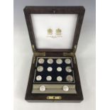 A cased presentation set of Firmin and Sons White Star Line white-metal livery buttons and cuff