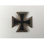 A German Third Reich Iron Cross first class, the pin marked 4