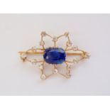 A Belle Epoque 4ct Burmese sapphire and diamond brooch, in a delicate openwork star-burst