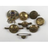 A number of Great War sweetheart brooches fabricated from British military buttons, together with
