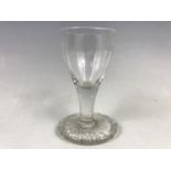 An 18th Century wine glass with over-sewn foot, 10 cm