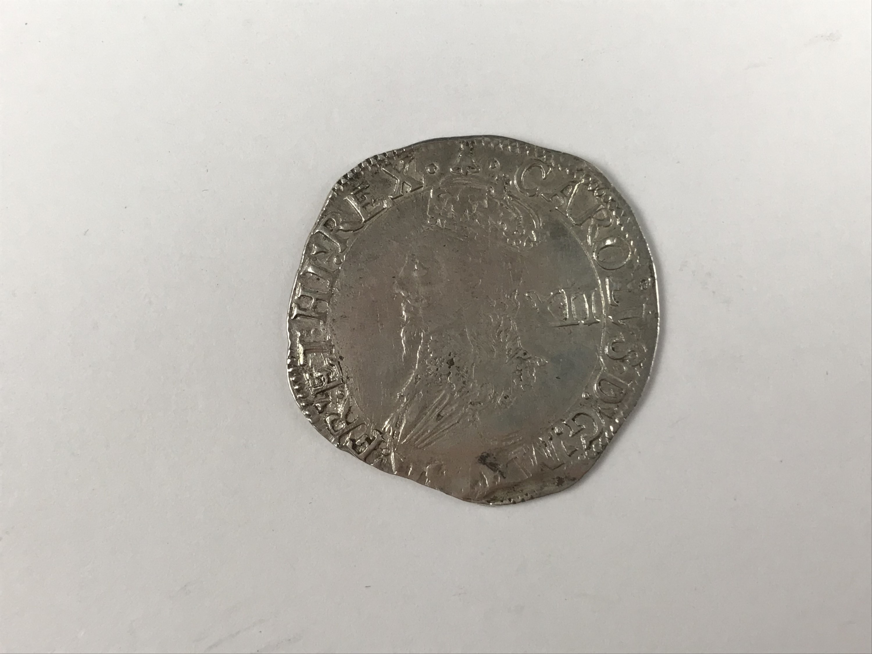 A Charles I hammered silver shilling coin, mint mark Bell (1634-5)