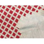 A late Victorian patchwork bedspread, in a diaper design of red and white cotton, approximately