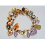 A lady's 9ct gold curb-link charm bracelet and gemstone charms, the latter including a David