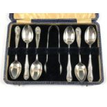 A cased set of six Edwardian silver feather-edge pattern teaspoons and sugar tongs, Charles Boyton &