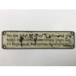 A brass instruction plaque from German armament or machinery, 21 cm x 5 cm