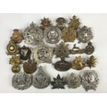 A quantity of Canadian cap badges