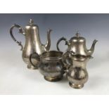 A Victorian silver four-piece tea service, of baluster form, having engraved and wriggle-work