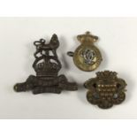 A Royal West Kent Regiment officer's Service Dress cap badge, together with a Victorian 7th Queen'
