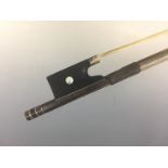 A violin bow by Hermann Richard Pfretzschner (1857-1921), having a white-metal mounted ebony frog