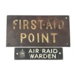 A small metal Air Raid Warden sign, together with a First-Aid Point sign