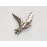 An Ola Gorie (20th Century) silver brooch, modelled in the form of a swooping bird, Edinburgh, 1975,