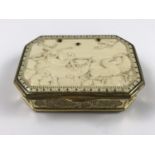 An 18th Century carved ivory and gilt-metal snuff box, of rectangular section with canted corners,