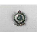 A Second World War Women's Forestry Service enamelled lapel badge