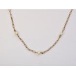 An early 20th Century fine yellow-metal and pearl neck chain, having cusped links interspersed by