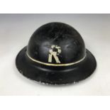 A Second World War Civil Defense Repair Party helmet