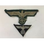 A German Third Reich Berlin SA Wehrmannschaft side cap machine woven badge together with an Army