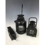 Three railway lanterns, including the "Adlake" Non-Sweating Lamp, 33 cm high (excluding handle), a