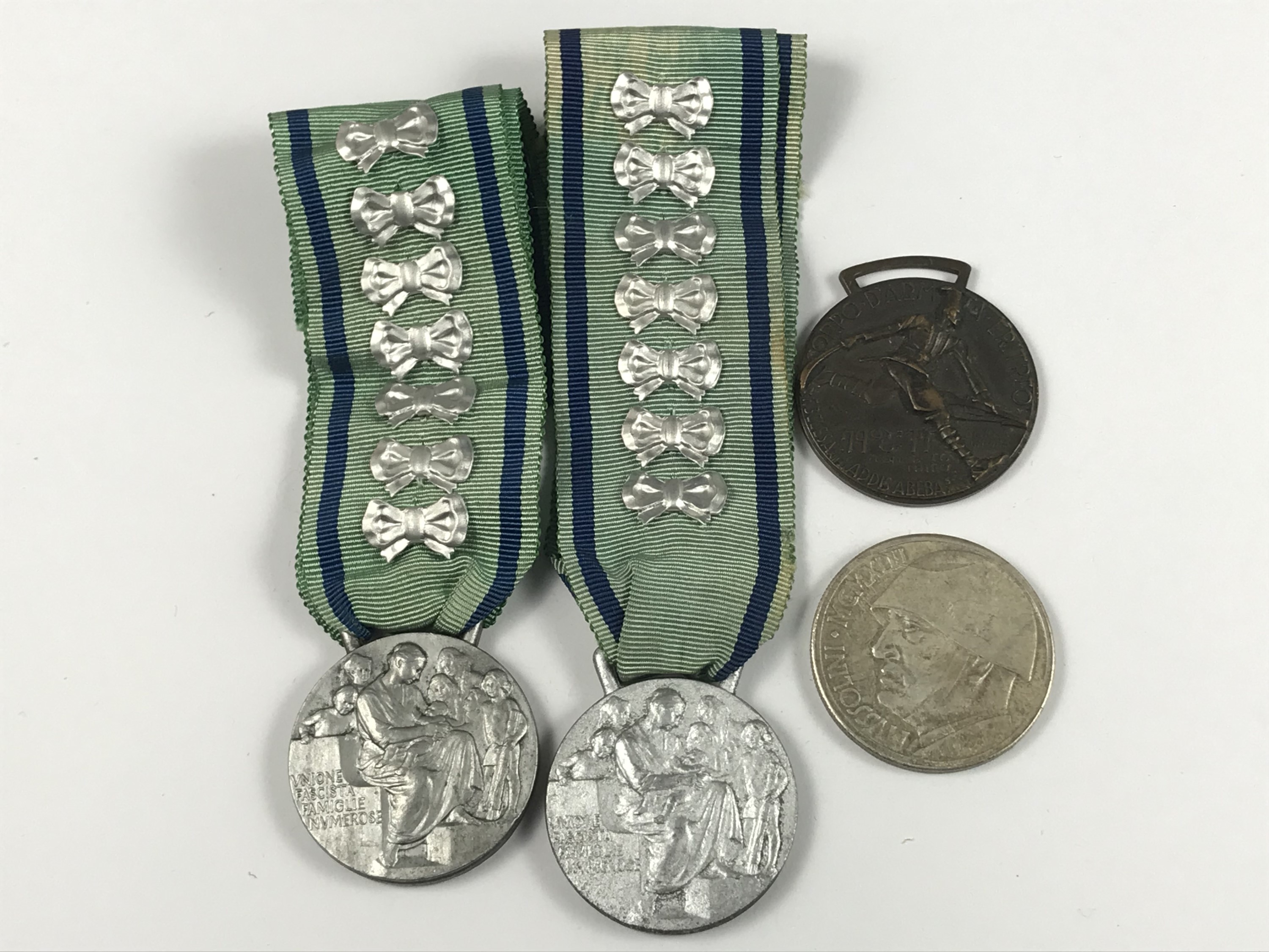 Three Fascist Italian medals and a coin