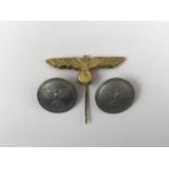 Two German Third Reich buttons and a cap badge