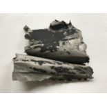 A fragment of aircraft fuselage skin bearing the inscription Ju88 Holmwood South Dorking, approx