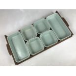 A Poole Pottery Art Deco Pastel Green hors d'oeuvres set, comprising oak tray and dishes, the latter