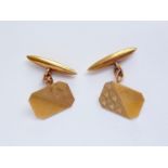 A gentleman's pair of 9ct gold cuff links, of rectangular shape with canted corners, guilloche
