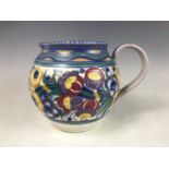 A 1930s Poole Pottery flower jug decorated by Nellie Bishton, of compressed ovoid form, having