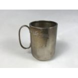 A George V silver cup, of cylindrical form, with a loop handle, Deykin and Harrison, Birmingham,