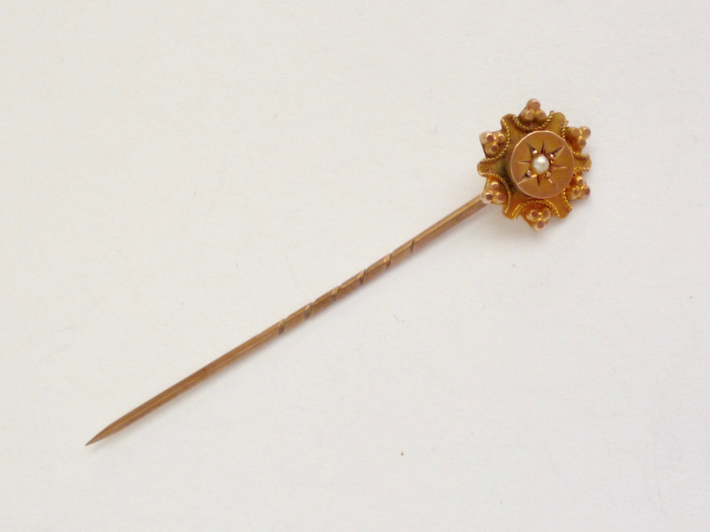 A late Victorian 9ct gold and split seed pearl stick pin, gypsy set within a pelleted and cannetille - Image 3 of 3
