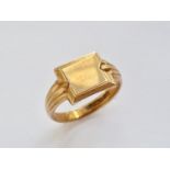 A gentleman's 9ct gold signet ring, having a square face with a bevelled and guilloche engraved