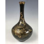 A Meiji Japanese Satsuma bottle vase bearing the signature of Kinkozan Studios of Kyoto, decorated