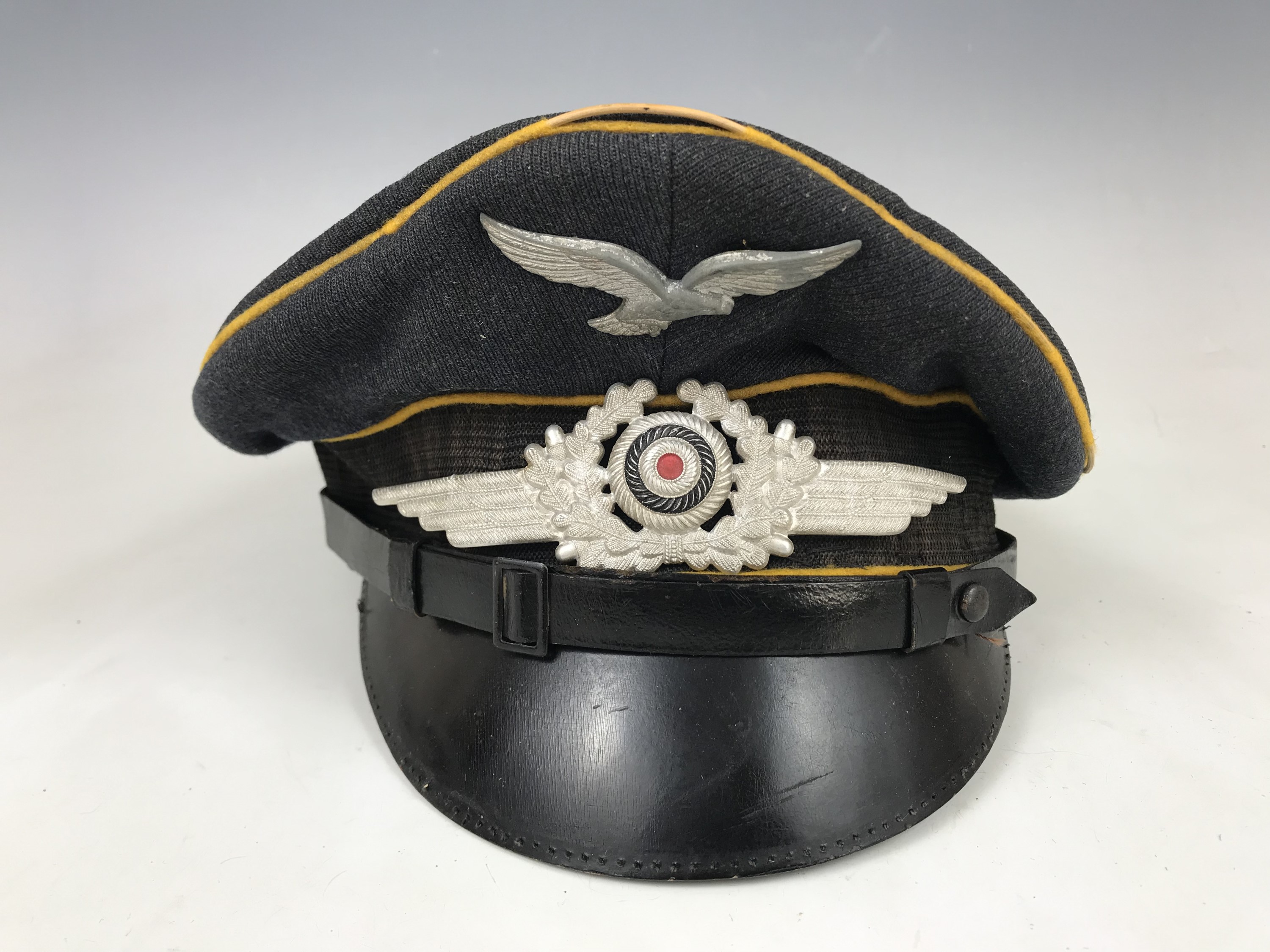 A Luftwaffe other rank's / NCO's peaked hat, (a/f)