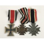 A German Third Reich Iron Cross second class, together with a War Merit Cross with swords second
