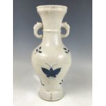 An early 20th Century Chinese blue and white vase, of yen yen form with loop handles, simply